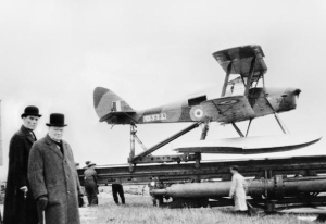 Winston Churchill at launch of De Havilland Queen Bee drone 1941.  Copyright Imperial War Museum
